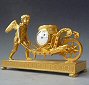 Attractive small mantel clock / pendulette, Amor with wheelbarrow, Austria circa 1810.